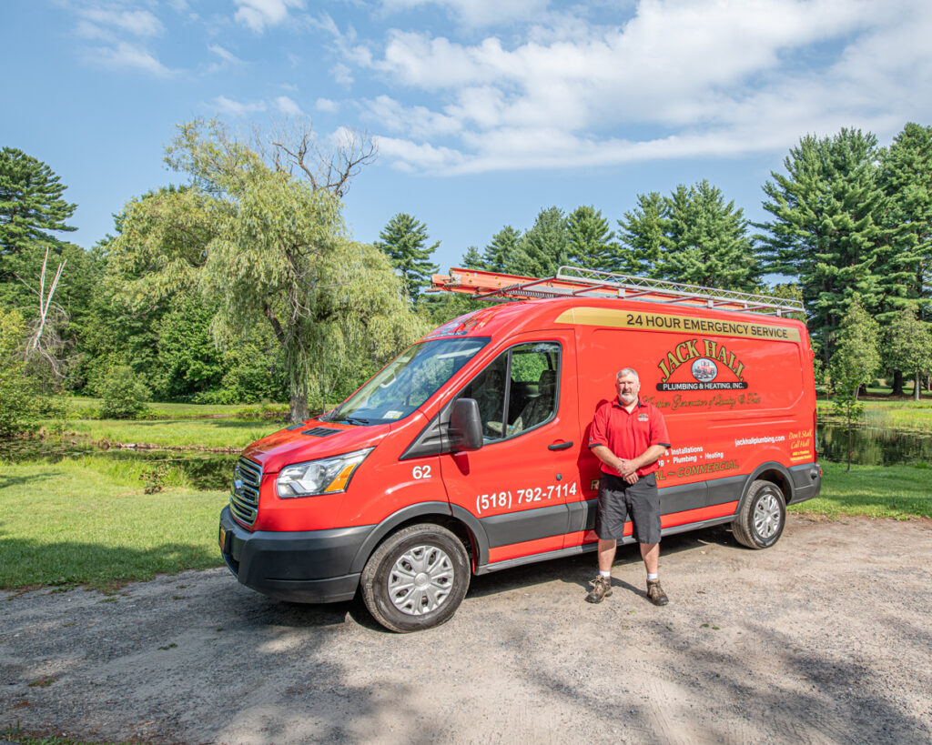 jack hall technician next to van