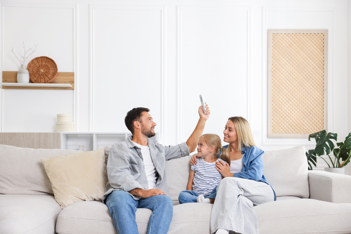 happy family using remote thermostat